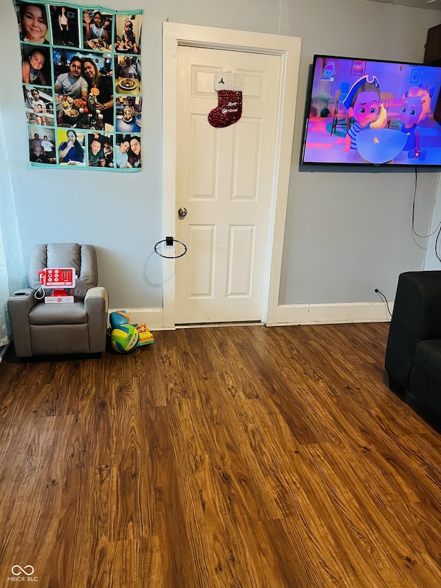918 N Olney St, Indianapolis, IN 46201 - sitting room with wood finished floors and baseboards