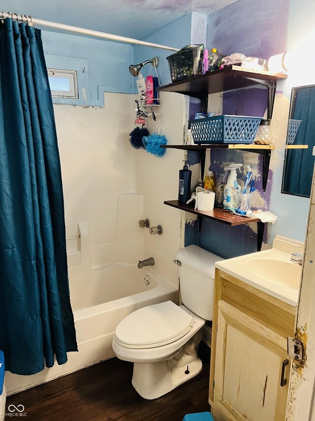 918 N Olney St, Indianapolis, IN 46201 - bathroom featuring shower / bath combo, toilet, vanity, and wood finished floors