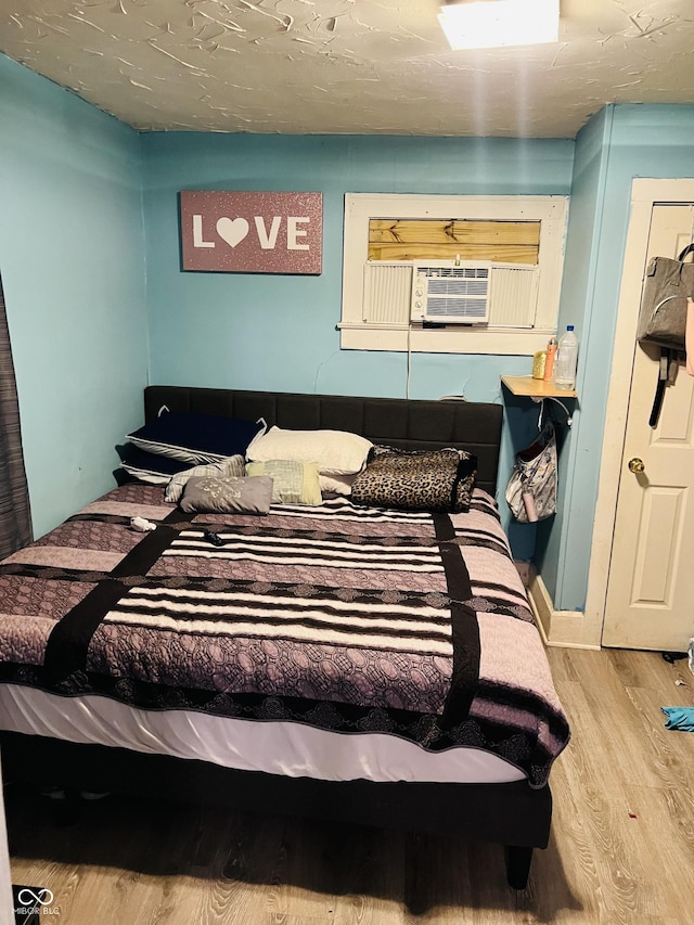 918 N Olney St, Indianapolis, IN 46201 - bedroom with cooling unit and wood finished floors