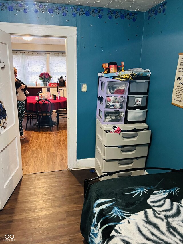 918 N Olney St, Indianapolis, IN 46201 - bedroom with baseboards and wood finished floors