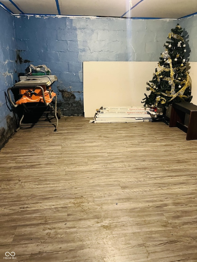 918 N Olney St, Indianapolis, IN 46201 - interior space with wood finished floors and concrete block wall