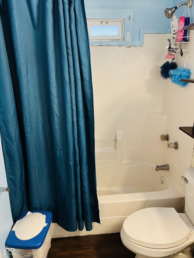 918 N Olney St, Indianapolis, IN 46201 - full bath featuring shower / bath combo, toilet, and wood finished floors