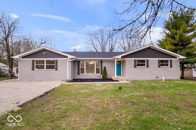 ranch-style house with a front yard, brick siding, driveway, and a chimney