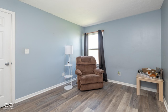 329 Dogwood Dr, Pendleton, IN 46064 - sitting room with wood finished floors and baseboards
