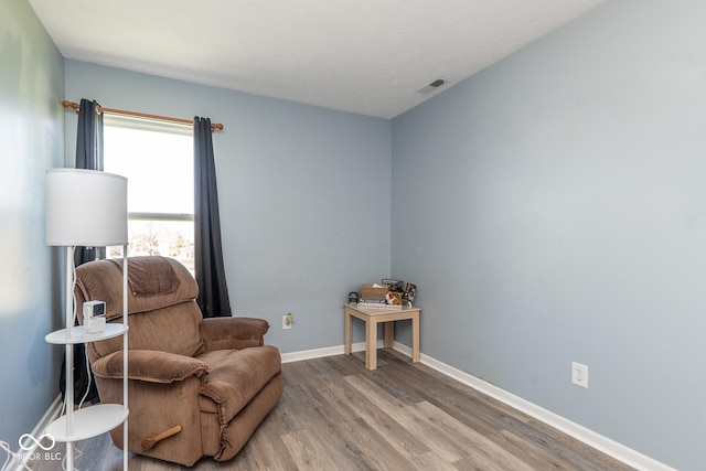 329 Dogwood Dr, Pendleton, IN 46064 - living area featuring wood finished floors and baseboards