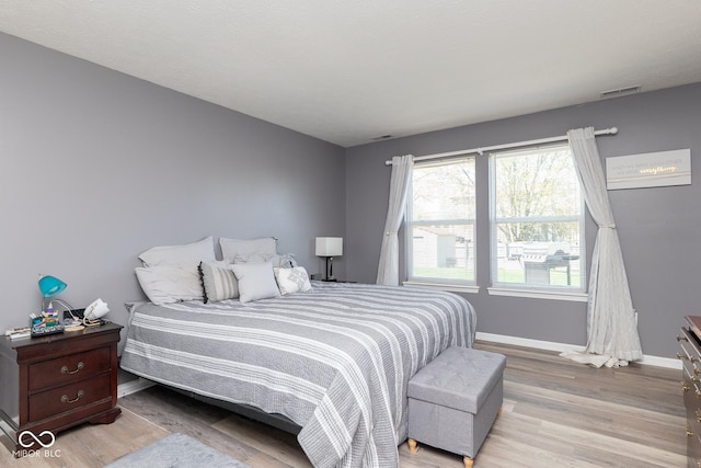 329 Dogwood Dr, Pendleton, IN 46064 - bedroom featuring light wood-style flooring and baseboards