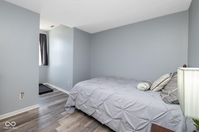 329 Dogwood Dr, Pendleton, IN 46064 - bedroom featuring wood finished floors and baseboards