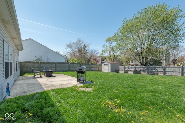 329 Dogwood Dr, Pendleton, IN 46064 - view of yard featuring a patio, a storage unit, and an outbuilding