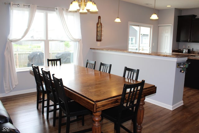 981 Redwood Dr, Franklin, IN 46131 - dining room featuring a chandelier, dark wood-style floors, and healthy amount of natural light