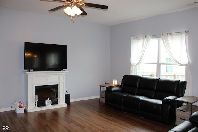 981 Redwood Dr, Franklin, IN 46131 - living area with a ceiling fan, wood finished floors, and a fireplace with raised hearth