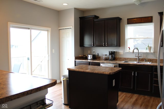 981 Redwood Dr, Franklin, IN 46131 - kitchen featuring a kitchen island, wood finished floors, dark countertops, and recessed lighting