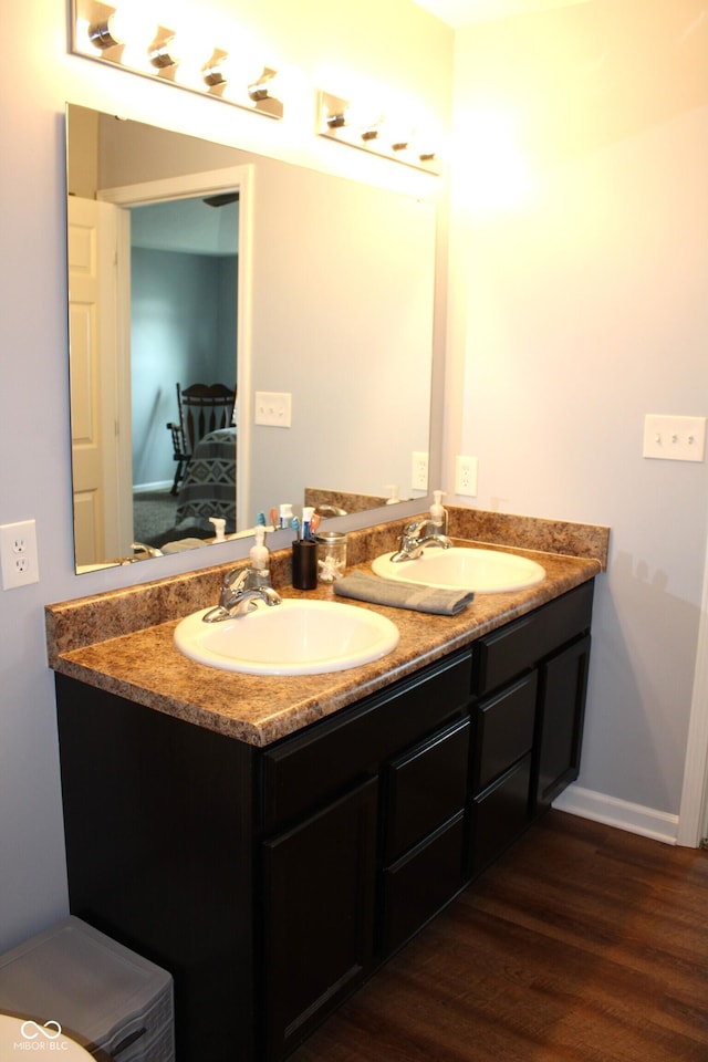 981 Redwood Dr, Franklin, IN 46131 - ensuite bathroom featuring double vanity and wood finished floors