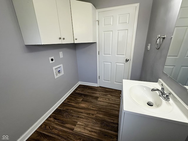 bathroom featuring baseboards, wood finished floors, and vanity