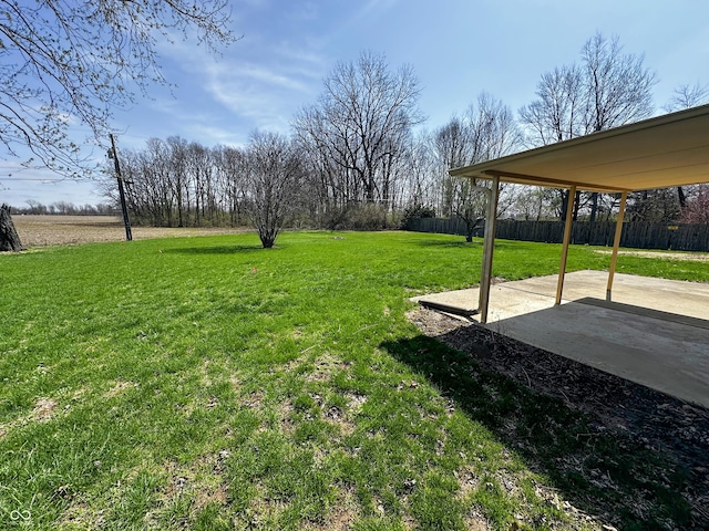 view of yard with fence and a patio area