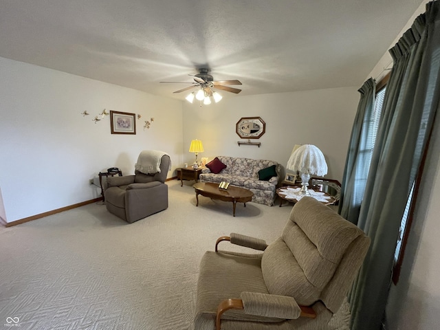 1310 Pin Oak Dr, Seymour, IN 47274 - living room featuring carpet, baseboards, and ceiling fan
