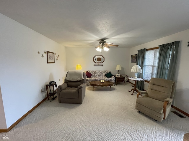 1310 Pin Oak Dr, Seymour, IN 47274 - carpeted living room with baseboards, visible vents, and ceiling fan