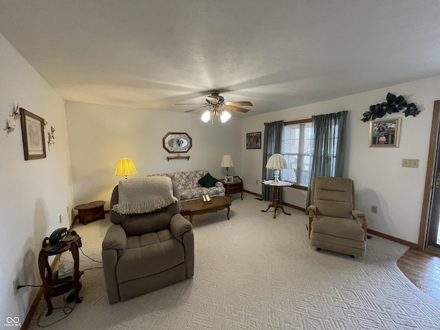 1310 Pin Oak Dr, Seymour, IN 47274 - living area featuring light carpet, baseboards, and a ceiling fan