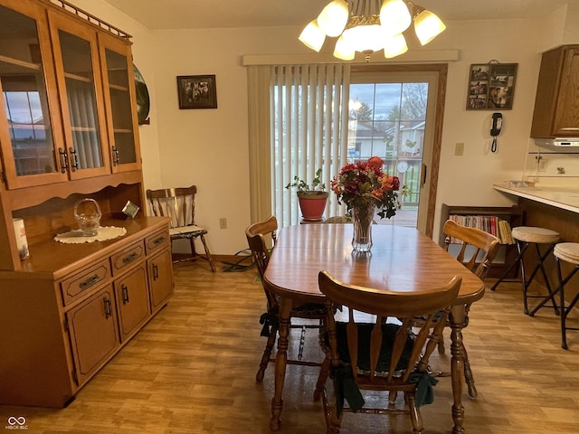 1310 Pin Oak Dr, Seymour, IN 47274 - dining room featuring light wood-style flooring and a notable chandelier