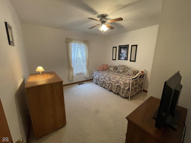 1310 Pin Oak Dr, Seymour, IN 47274 - bedroom featuring ceiling fan, baseboards, light colored carpet, and visible vents