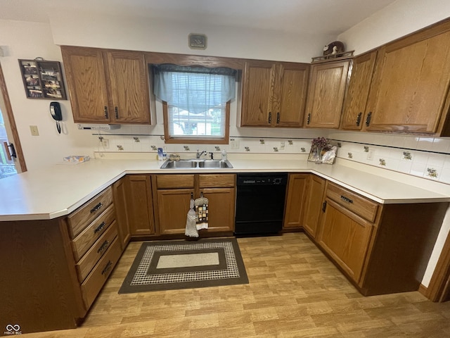 1310 Pin Oak Dr, Seymour, IN 47274 - kitchen with light countertops, tasteful backsplash, a sink, dishwasher, and a peninsula
