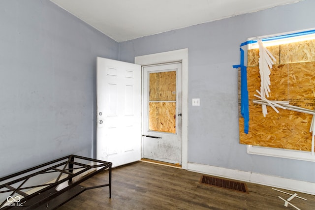 interior space featuring visible vents and wood finished floors