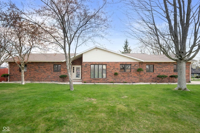 single story home featuring a front yard and brick siding
