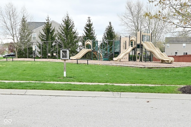 communal playground featuring a yard