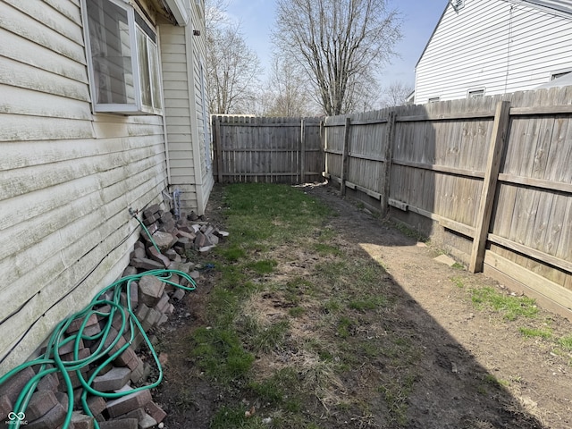 view of yard with a fenced backyard