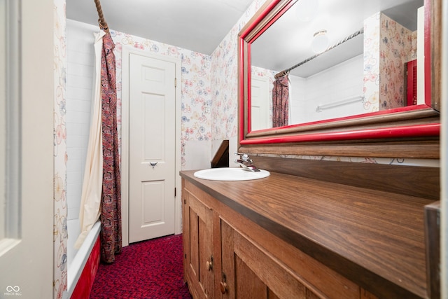 full bathroom featuring shower / tub combo, vanity, and wallpapered walls