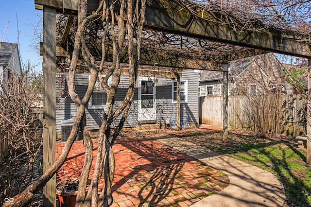exterior space featuring entry steps, cooling unit, and fence