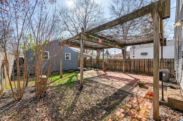 view of yard featuring a patio area, fence, and a pergola