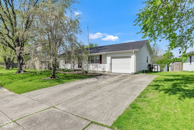 ranch-style home featuring an attached garage, a gate, driveway, and a front yard