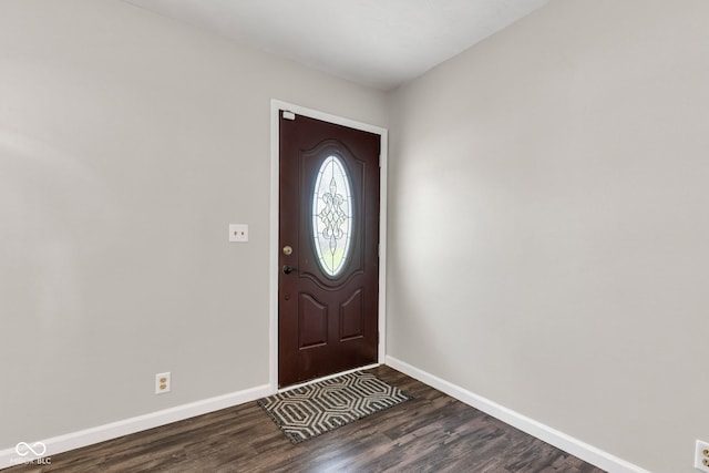 entrance foyer featuring baseboards and dark wood-style floors