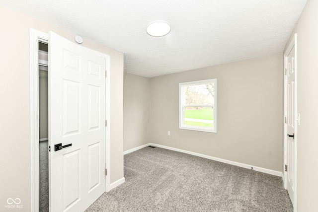 2420 Goose Creek Rd, Martinsville, IN 46151 - unfurnished bedroom featuring a textured ceiling, baseboards, and carpet floors