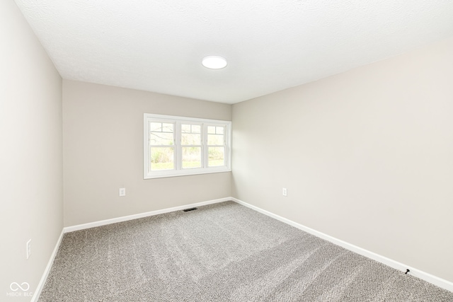 2420 Goose Creek Rd, Martinsville, IN 46151 - spare room featuring visible vents, baseboards, and carpet
