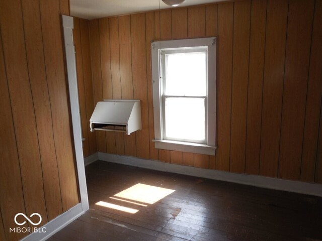 923 Woodview Blvd, Fort Wayne, IN 46806 - additional living space featuring baseboards, wooden walls, and hardwood / wood-style floors