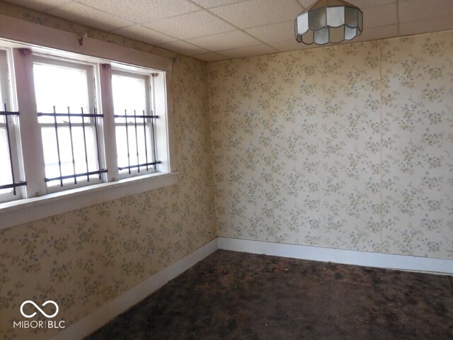 923 Woodview Blvd, Fort Wayne, IN 46806 - spare room featuring a drop ceiling, wallpapered walls, and baseboards