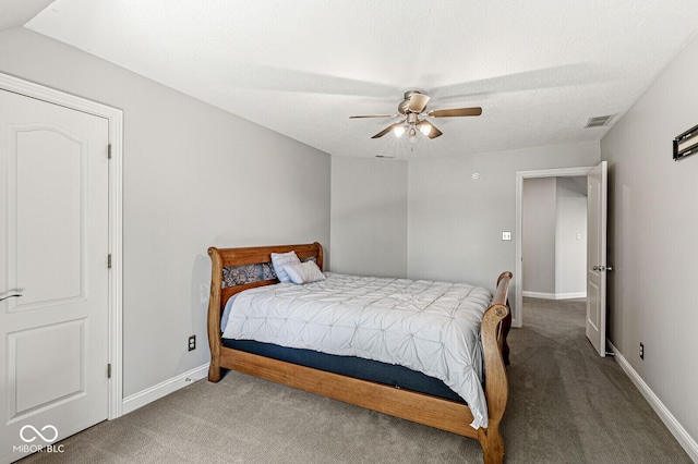 bedroom featuring baseboards, visible vents, a ceiling fan, and carpet floors