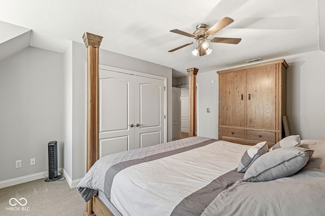 bedroom featuring ornate columns, a closet, carpet, baseboards, and visible vents