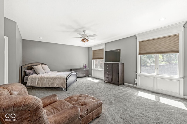 bedroom with visible vents, ceiling fan, carpet flooring, and baseboards