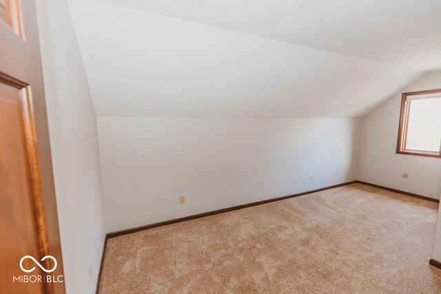 6712 Forrest Commons Blvd, Indianapolis, IN 46227 - bonus room featuring carpet flooring, vaulted ceiling, and baseboards