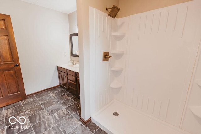 6712 Forrest Commons Blvd, Indianapolis, IN 46227 - full bathroom featuring baseboards, walk in shower, and vanity