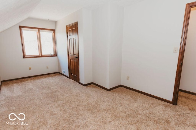 6712 Forrest Commons Blvd, Indianapolis, IN 46227 - interior space with baseboards, carpet flooring, and vaulted ceiling