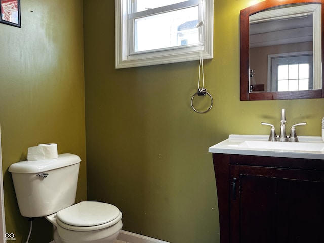 310 E Central Ave, Greensburg, IN 47240 - half bath featuring plenty of natural light, toilet, vanity, and baseboards