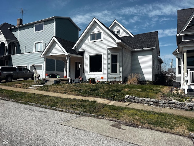 310 E Central Ave, Greensburg, IN 47240 - traditional-style house featuring a shingled roof, covered porch, and an attached garage