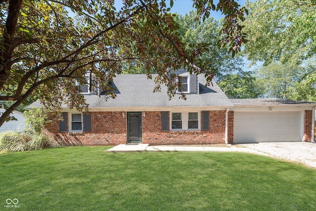 cape cod-style house featuring a front lawn, driveway, a garage, and brick siding