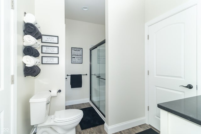 8267 W County Road 350 S, Shirley, IN 47384 - bathroom with a stall shower, toilet, wood finished floors, and baseboards