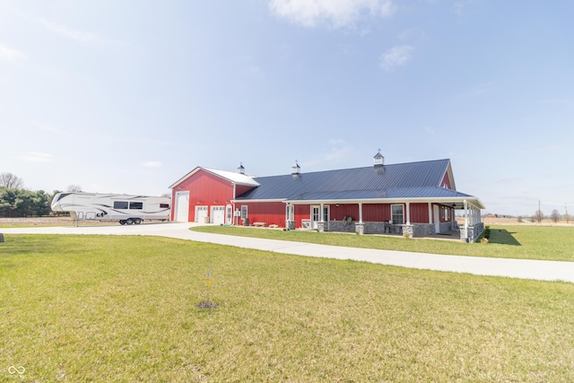 8267 W County Road 350 S, Shirley, IN 47384 - view of front of house featuring driveway, metal roof, and a front lawn