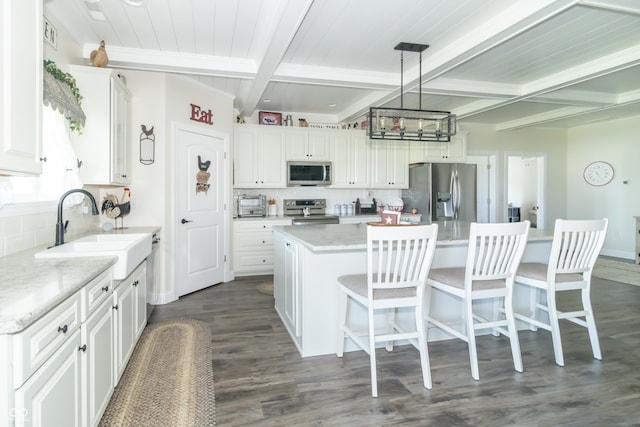 8267 W County Road 350 S, Shirley, IN 47384 - kitchen with white cabinets, tasteful backsplash, appliances with stainless steel finishes, a sink, and dark wood-style floors