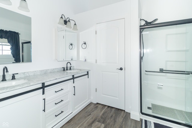 8267 W County Road 350 S, Shirley, IN 47384 - full bathroom with wood finished floors, a sink, double vanity, and a shower stall